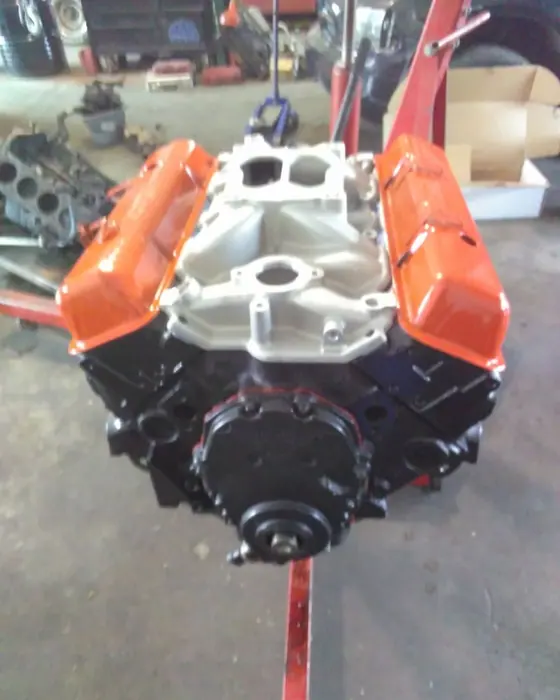 A built V8 on the stand with the intake and valve covers back on