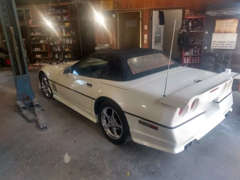 A Corvette convertible finished in white, back together in the bay